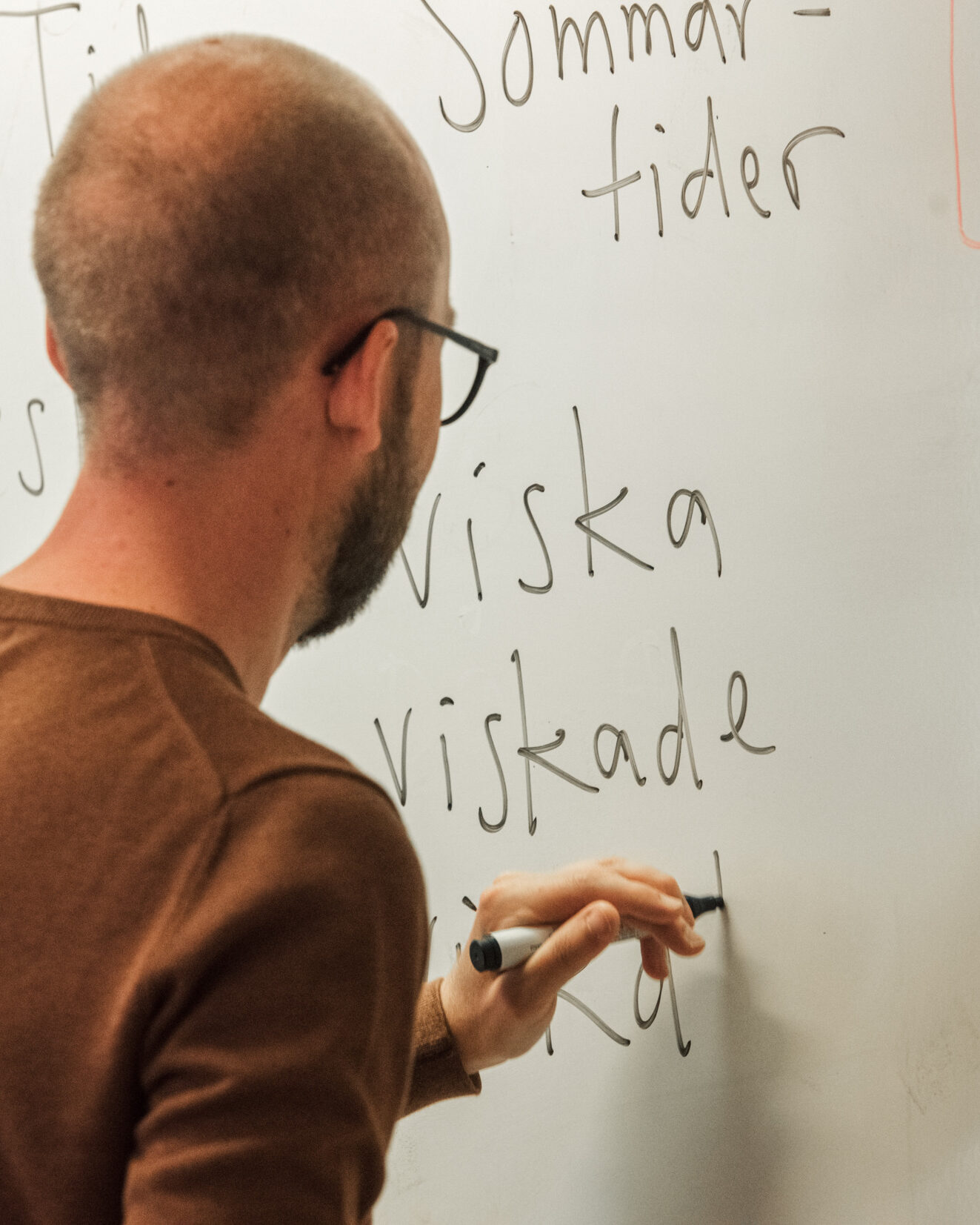 Man writing on a white board