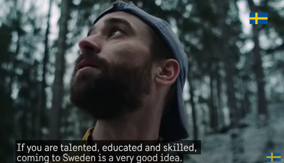 Man in cap standing in the forest