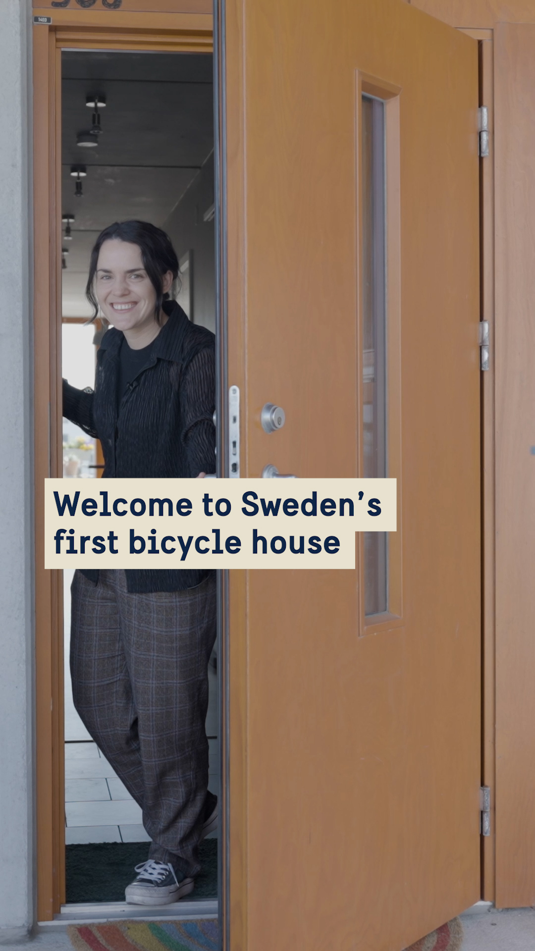 Woman opeing a door.