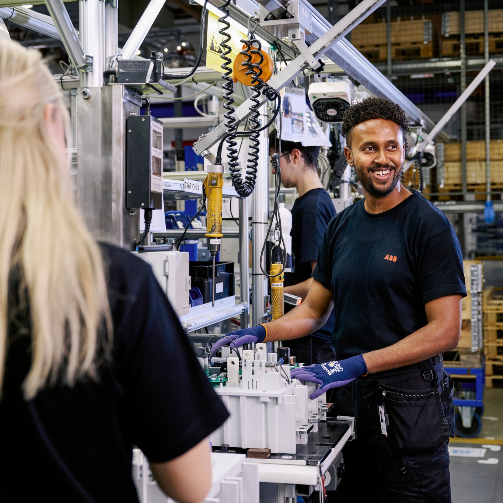 People working in a productin line