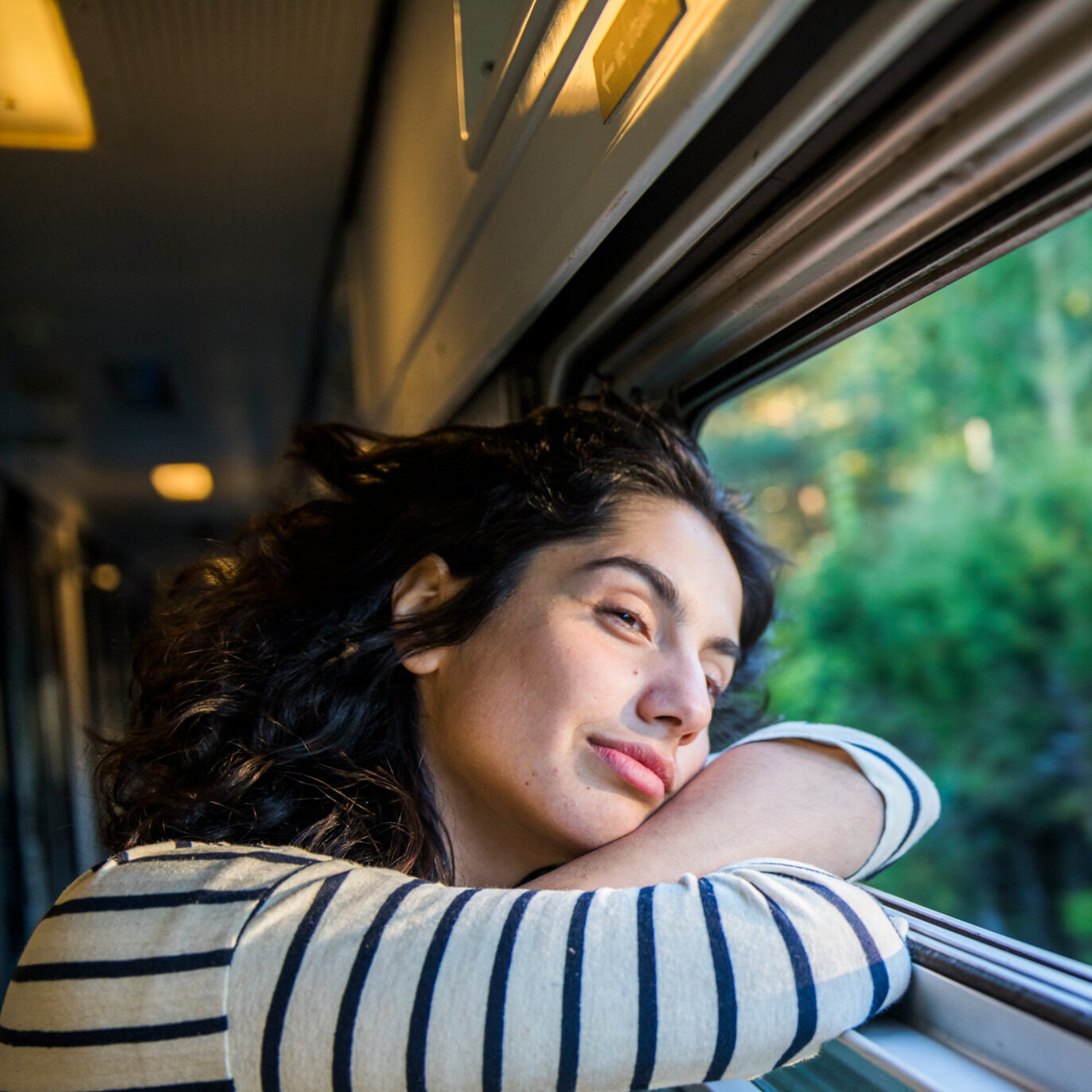 A woman travelling by train in Sweden.