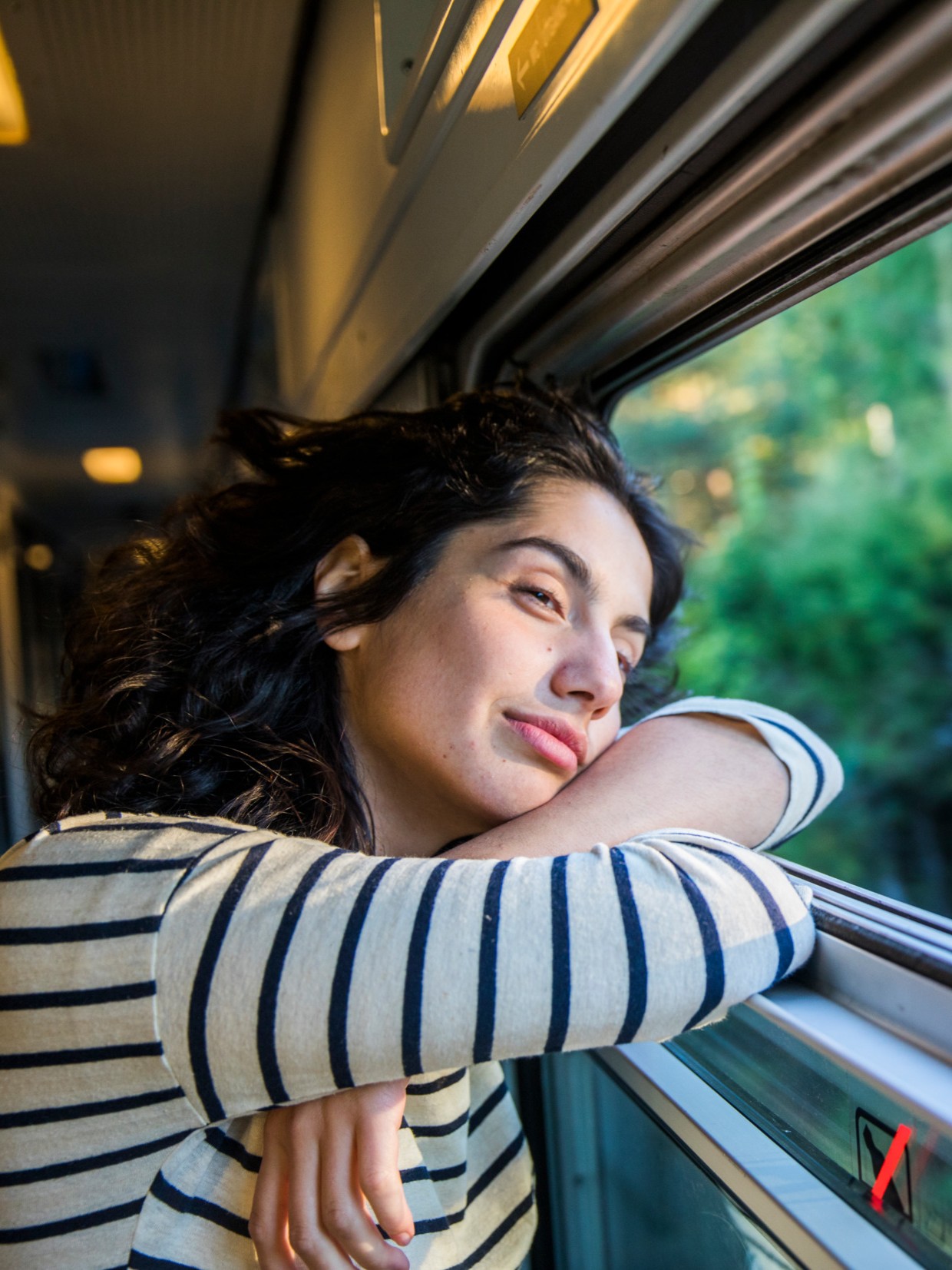 Person lookiing out a window on a train