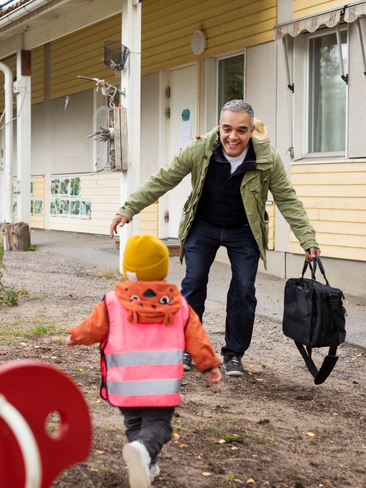 Father picking up his child from day care